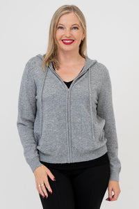 A woman wearing a gray zip-front hoodie with front pockets and a hood, made of wool and cashmere blend.