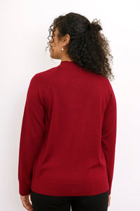 Rear view of a long sleeve dark red fine wool knit sweater showing clean back fit and ribbed hem.