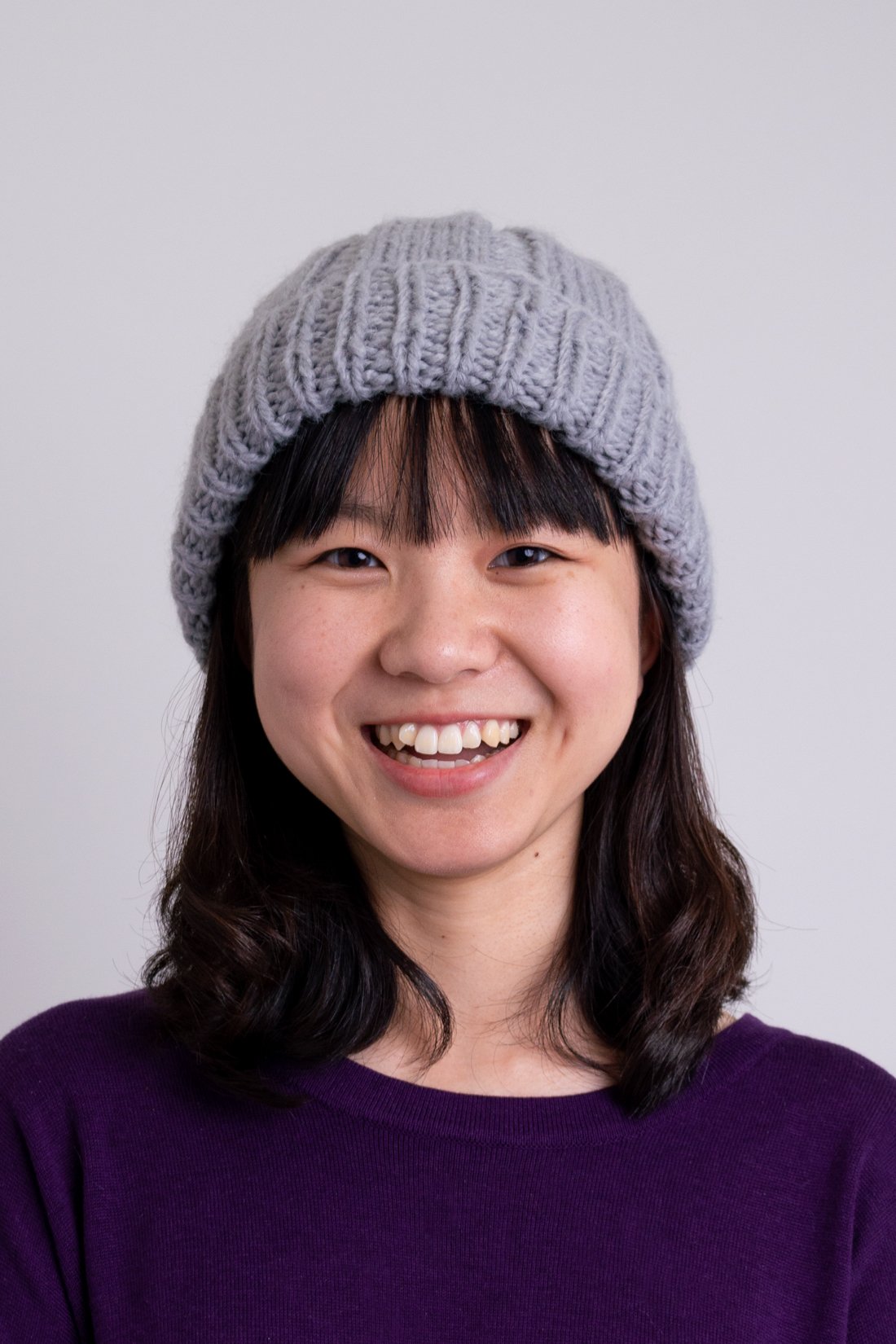Women's grey knit toque wool beanie hat.
