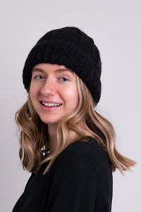 Women's black knit toque wool beanie hat.
