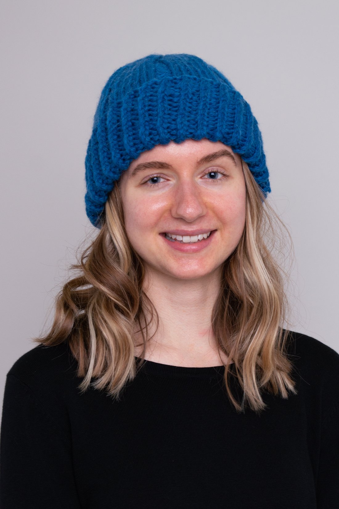 Women's teal blue toque wool beanie hat.