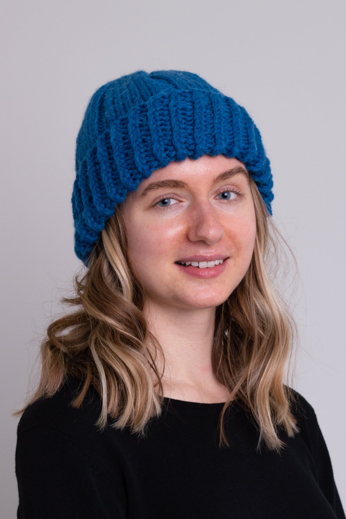 Women's teal blue toque wool beanie hat.