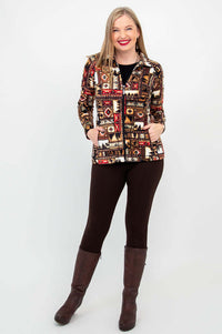 Woman facing camera in Sona bamboo zip jacket, brown leggings, and boots